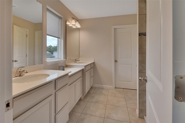 bathroom with tile patterned floors and vanity