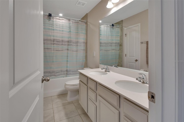 full bathroom with tile patterned flooring, vanity, shower / tub combo with curtain, and toilet