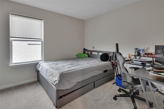 bedroom with light colored carpet