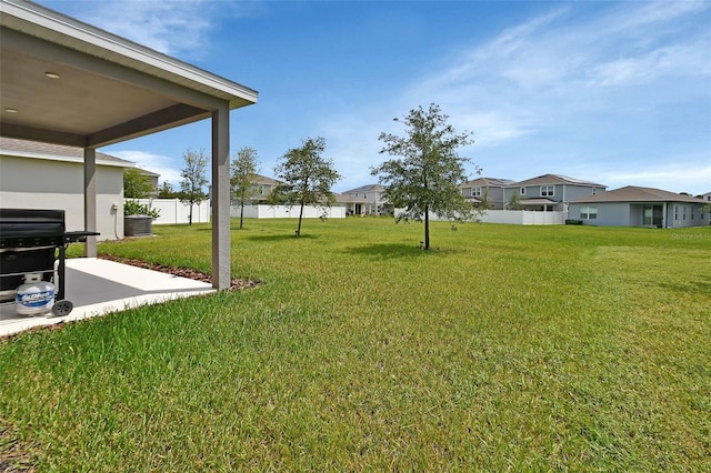 view of yard featuring a patio and central air condition unit