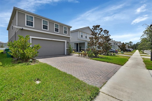 view of front of house featuring a garage and a front yard