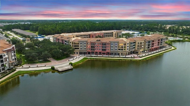 aerial view at dusk with a water view