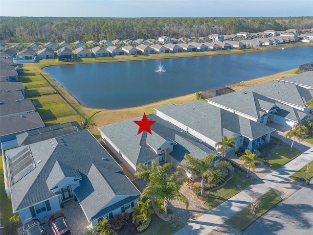 bird's eye view featuring a residential view and a water view