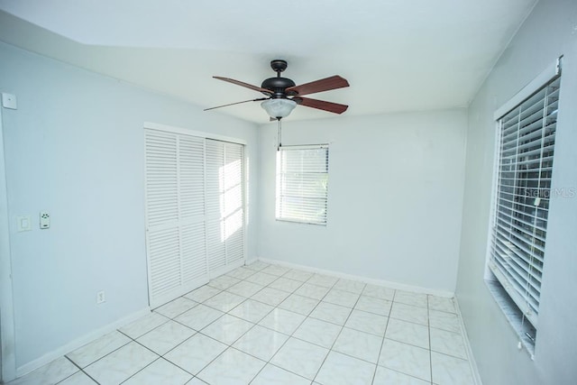 unfurnished bedroom featuring ceiling fan