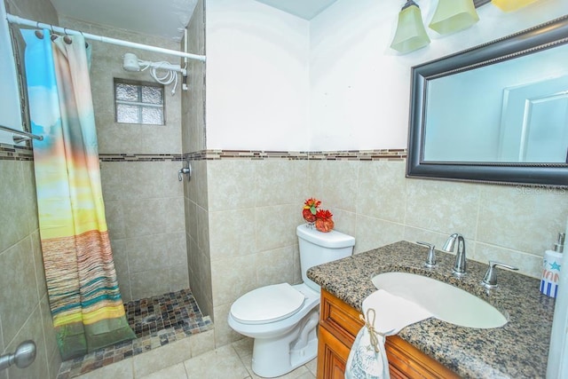 bathroom featuring vanity, tile walls, and curtained shower