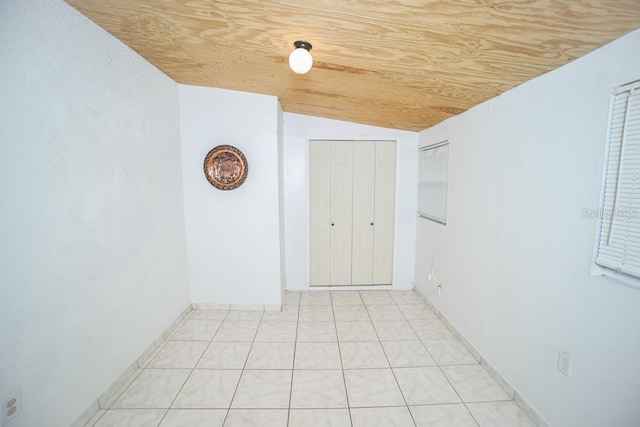 tiled spare room with lofted ceiling and wooden ceiling