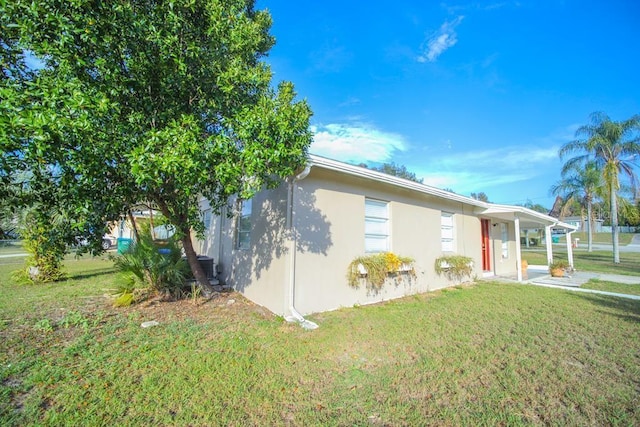 view of home's exterior featuring a lawn