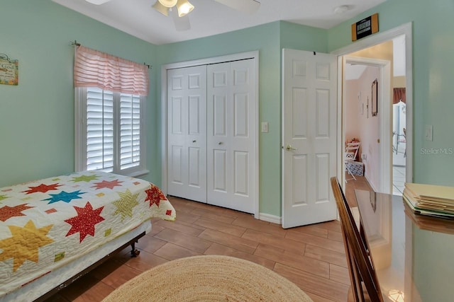 bedroom with ceiling fan and a closet