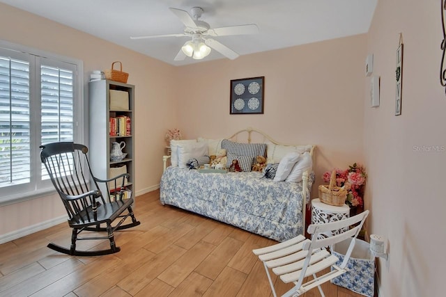 bedroom with hardwood / wood-style floors and ceiling fan