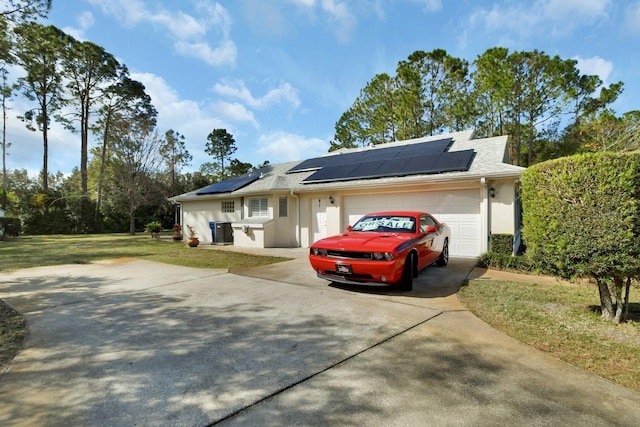 ranch-style home with central AC, a garage, a front yard, and solar panels