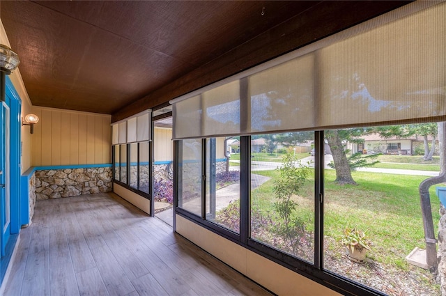 unfurnished sunroom featuring wood ceiling