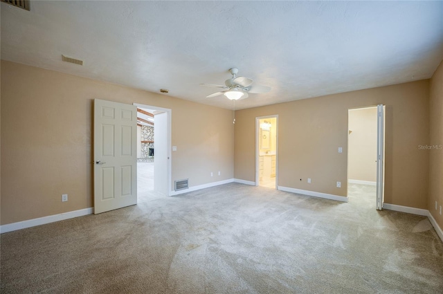 unfurnished room featuring light colored carpet and ceiling fan