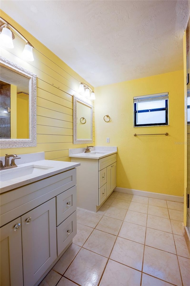 bathroom with vanity, tile patterned floors, and a textured ceiling