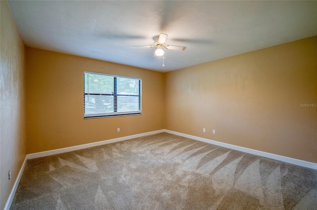 empty room featuring carpet and ceiling fan