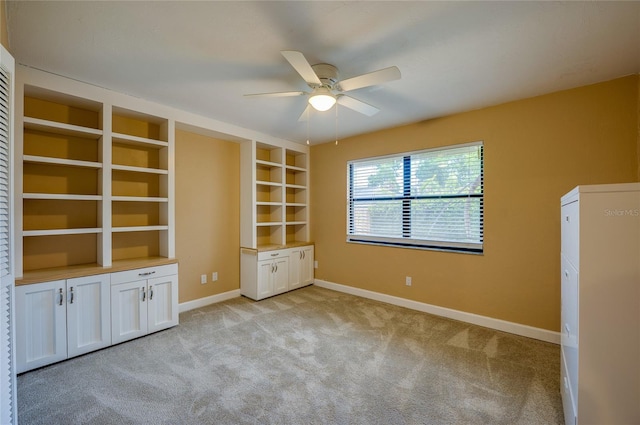 unfurnished bedroom with light colored carpet and ceiling fan