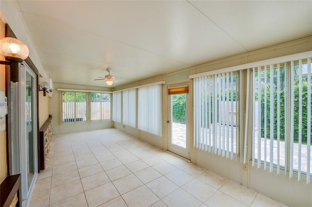 unfurnished sunroom with a wealth of natural light and ceiling fan