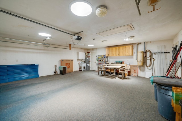 garage with a garage door opener and sink