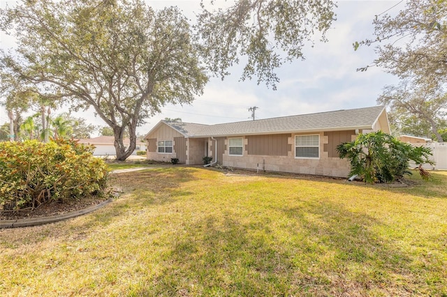 back of property featuring a lawn