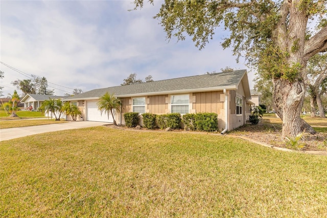 single story home with a garage and a front yard