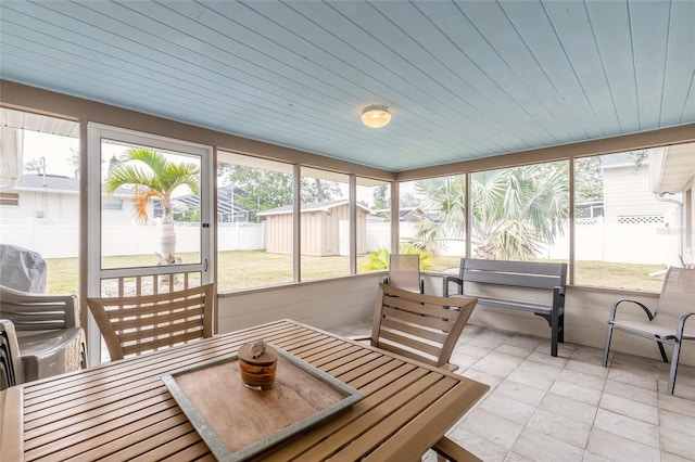 sunroom / solarium with wooden ceiling