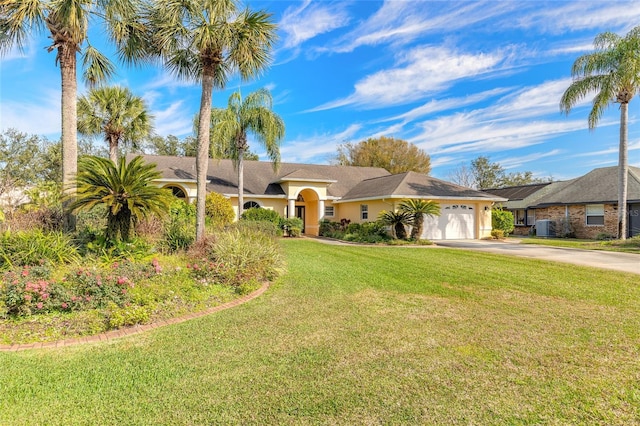 single story home with cooling unit, a garage, and a front lawn