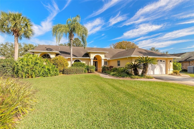 single story home featuring a garage, central AC unit, and a front yard