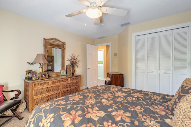 bedroom with a closet, ceiling fan, and carpet flooring