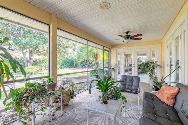 sunroom / solarium with ceiling fan and a healthy amount of sunlight