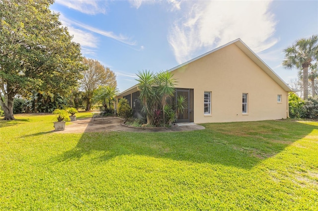 rear view of property with a lawn