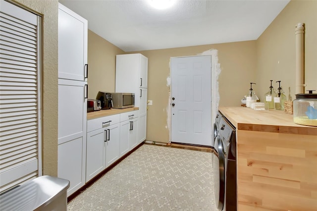 laundry room featuring washer / dryer