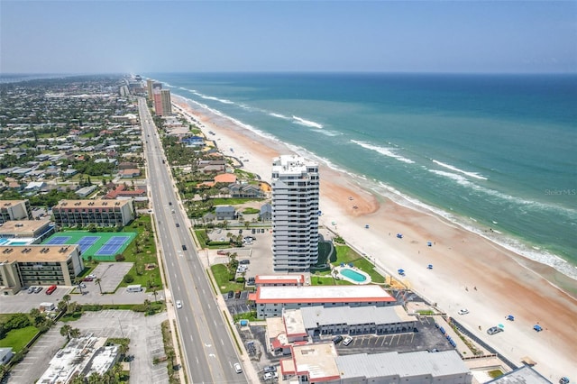 bird's eye view with a water view and a view of the beach