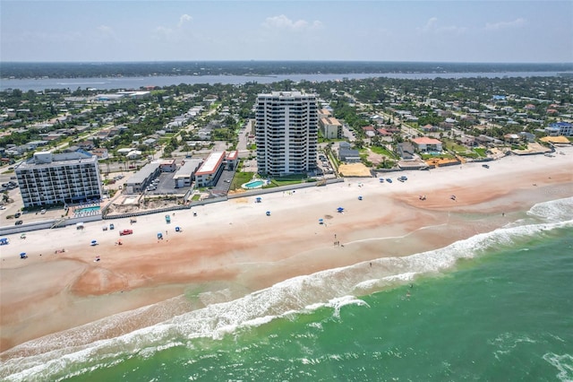 bird's eye view featuring a view of the beach and a water view