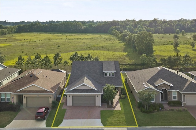 birds eye view of property featuring a rural view