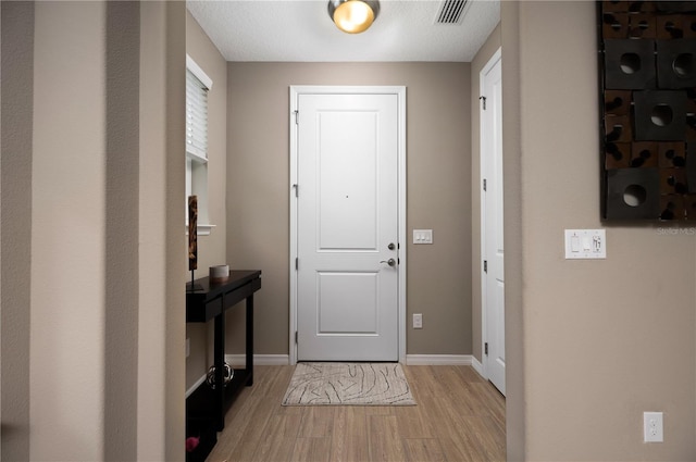 foyer with light hardwood / wood-style flooring