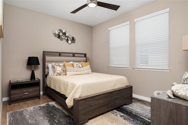 bedroom with hardwood / wood-style flooring and ceiling fan