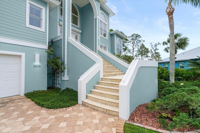 view of exterior entry with a garage