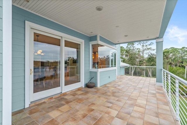 view of patio featuring a balcony