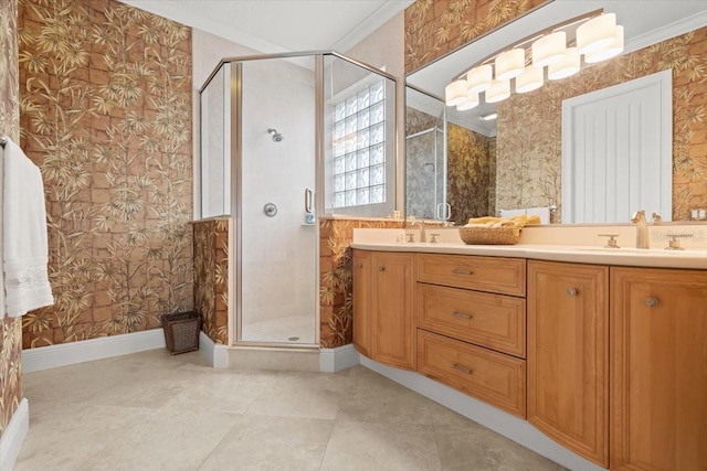 bathroom with ornamental molding, vanity, tile patterned floors, and walk in shower