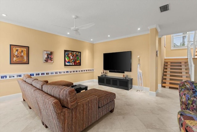 living room with ornamental molding and ceiling fan