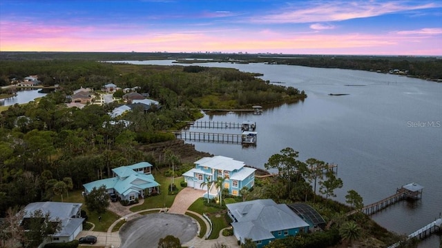 aerial view at dusk with a water view