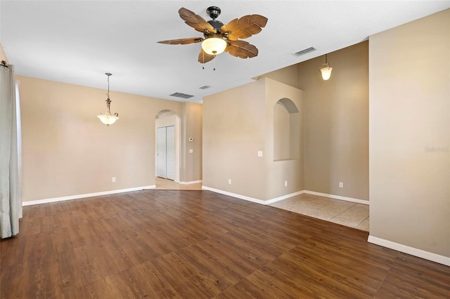 unfurnished room featuring wood-type flooring and ceiling fan