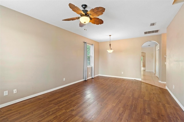 unfurnished room featuring wood-type flooring and ceiling fan