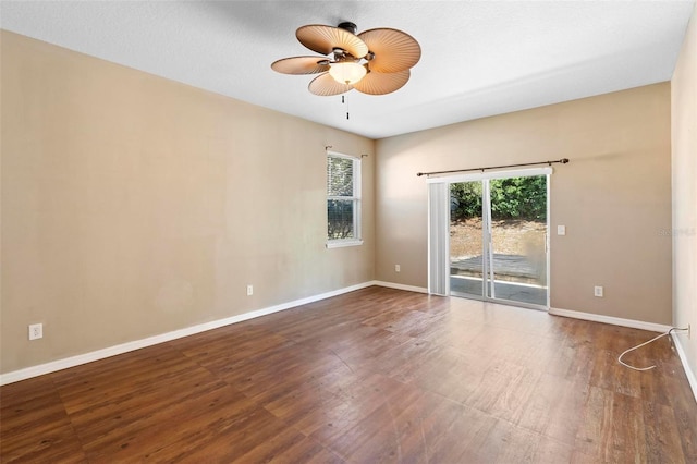 empty room featuring hardwood / wood-style floors and ceiling fan