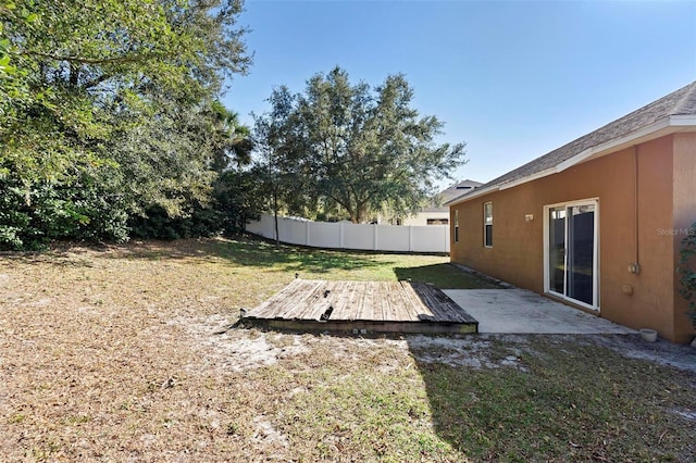 view of yard featuring a wooden deck