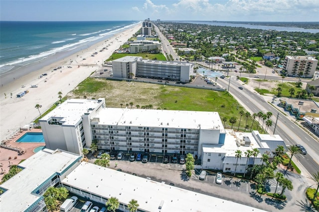 bird's eye view with a water view and a view of the beach