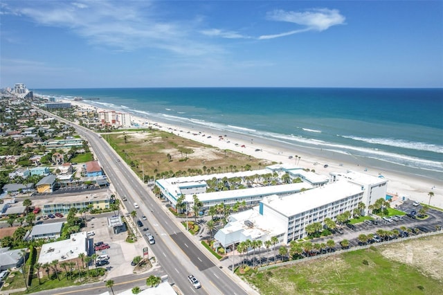 bird's eye view with a view of the beach and a water view