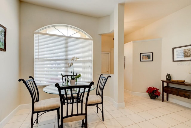 dining space featuring light tile patterned floors