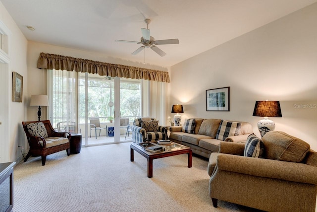 carpeted living room with french doors and ceiling fan