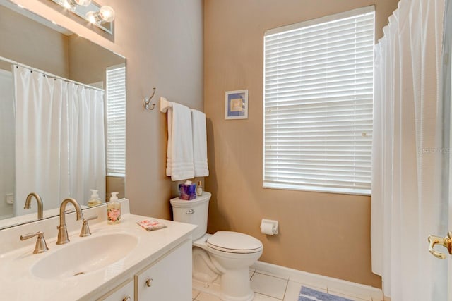 bathroom with vanity, tile patterned floors, and toilet