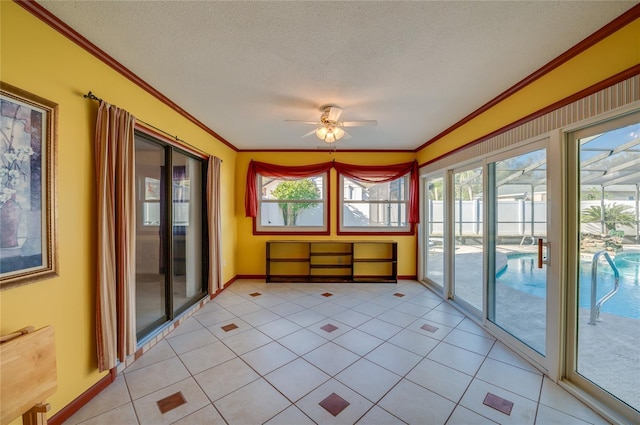 unfurnished sunroom with ceiling fan and a healthy amount of sunlight